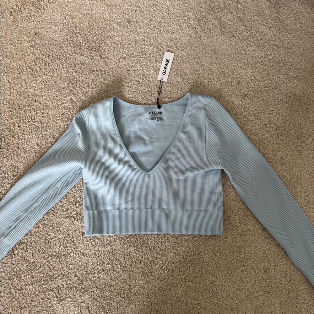 Light blue ripped cropped long sleeve garage